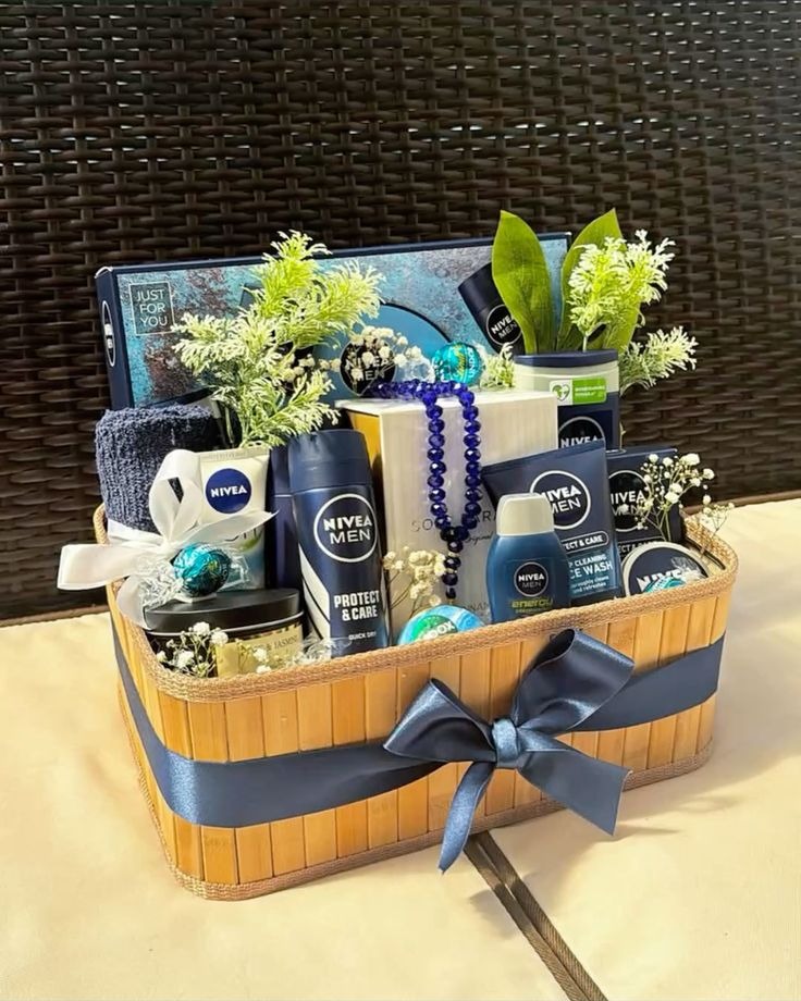 Men's grooming gift hamper in a bamboo basket with navy ribbon