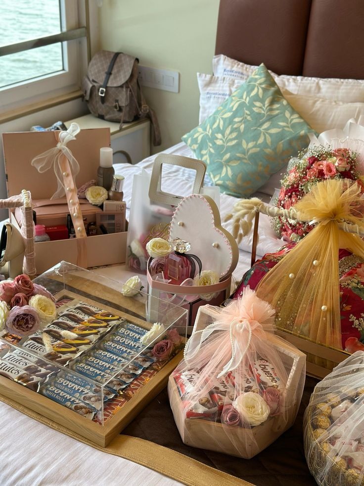 Festive gift hampers with chocolates, perfume and flowers